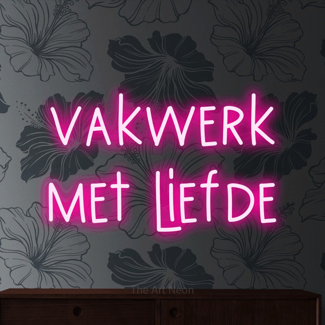 LED neon sign reading “vakwerk met liefde”, arranged in 2 lines.