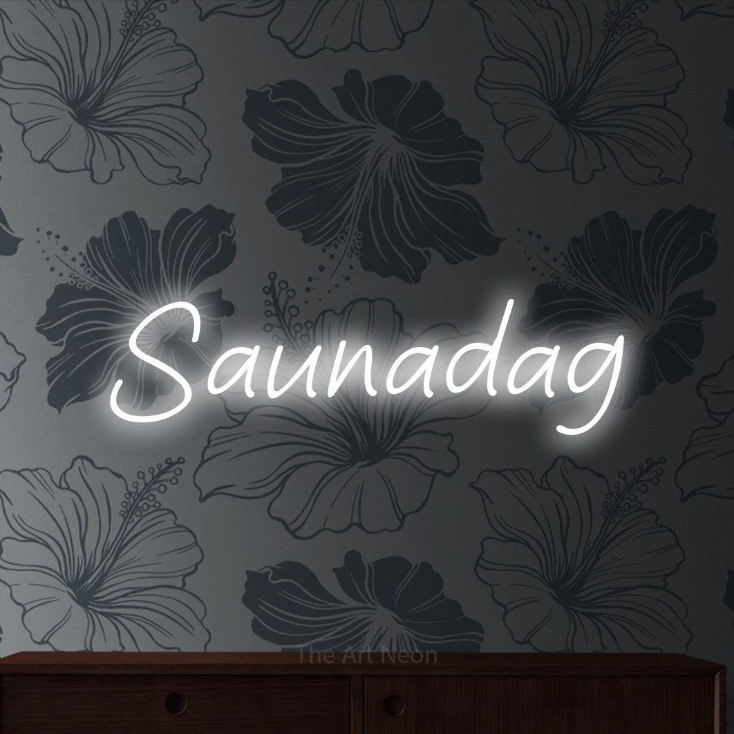 LED neon sign reading “Saunadag”, arranged in a single line.
