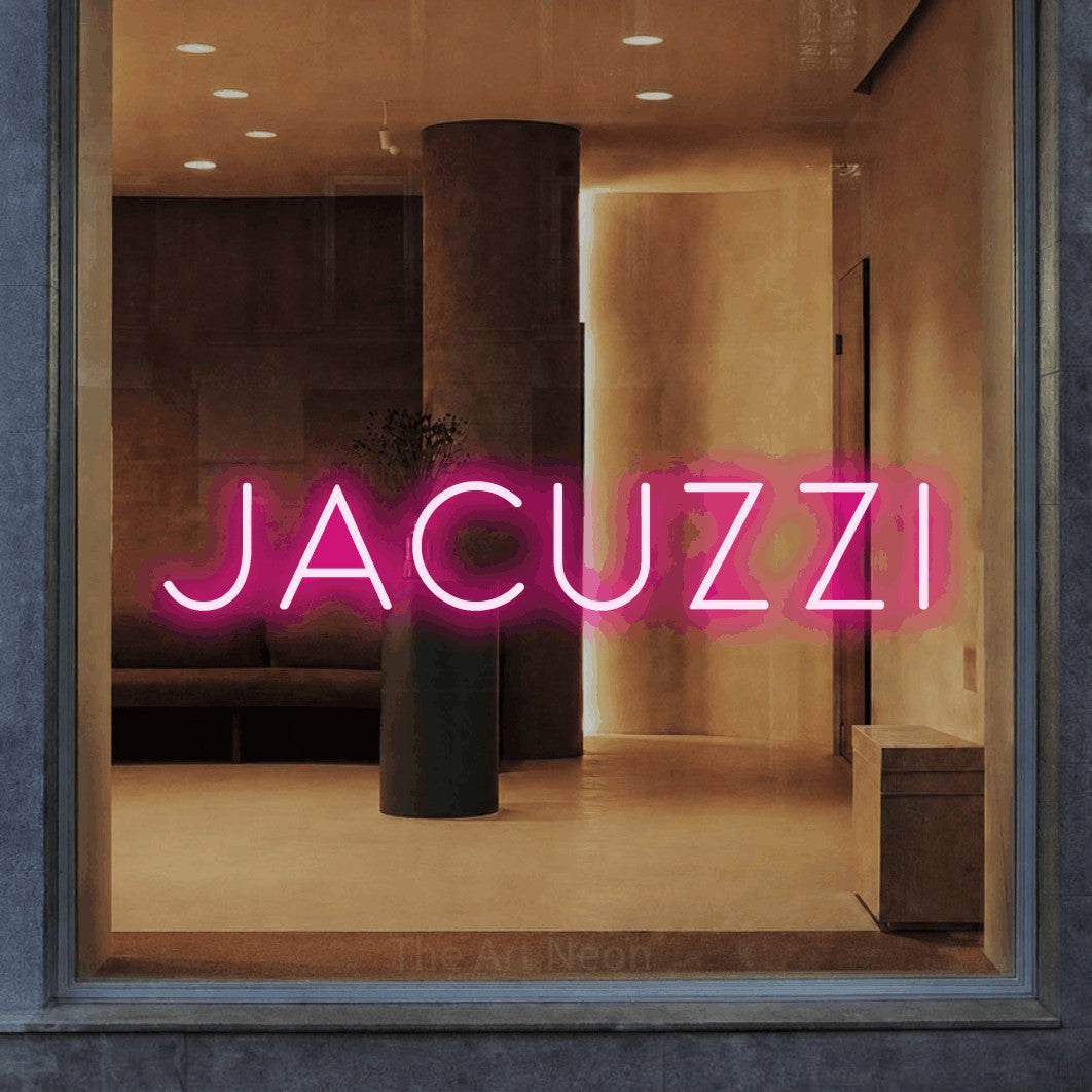LED neon sign reading “jacuzzi”, arranged in a single line.
