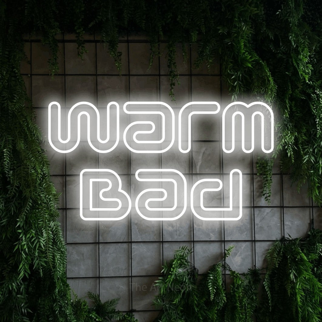 LED neon sign reading “Warm Bad”, arranged in 2 lines.