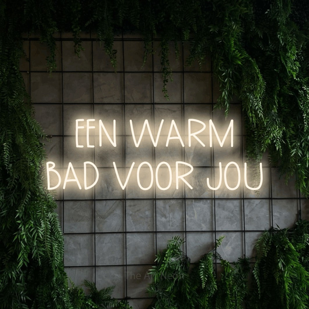 LED neon sign reading “EEN WARM BAD VOOR JOU”, arranged in 2 lines.