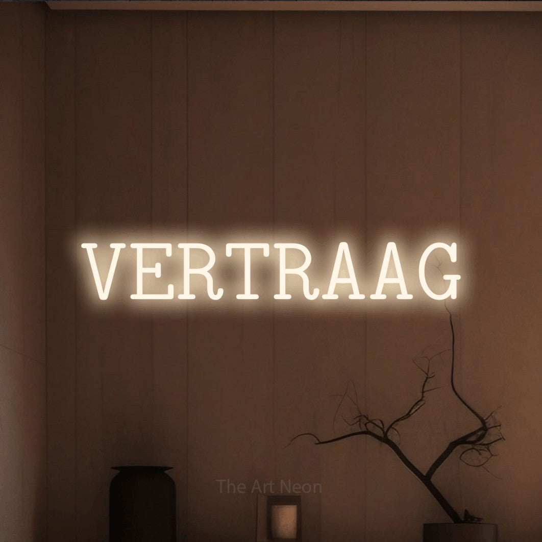 LED neon sign reading “VERTRAAG”, arranged in a single line.
