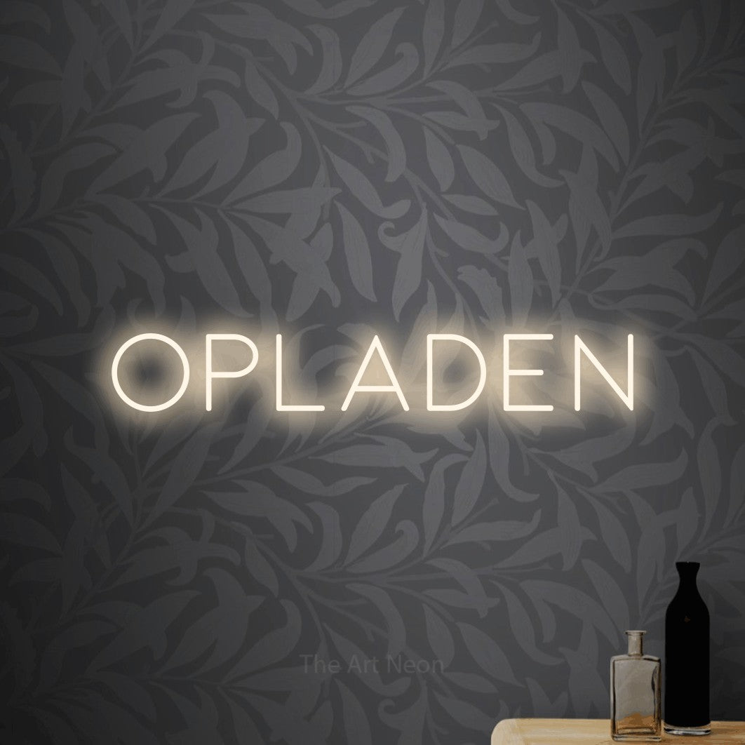 LED neon sign reading “Opladen”, arranged in a single line.