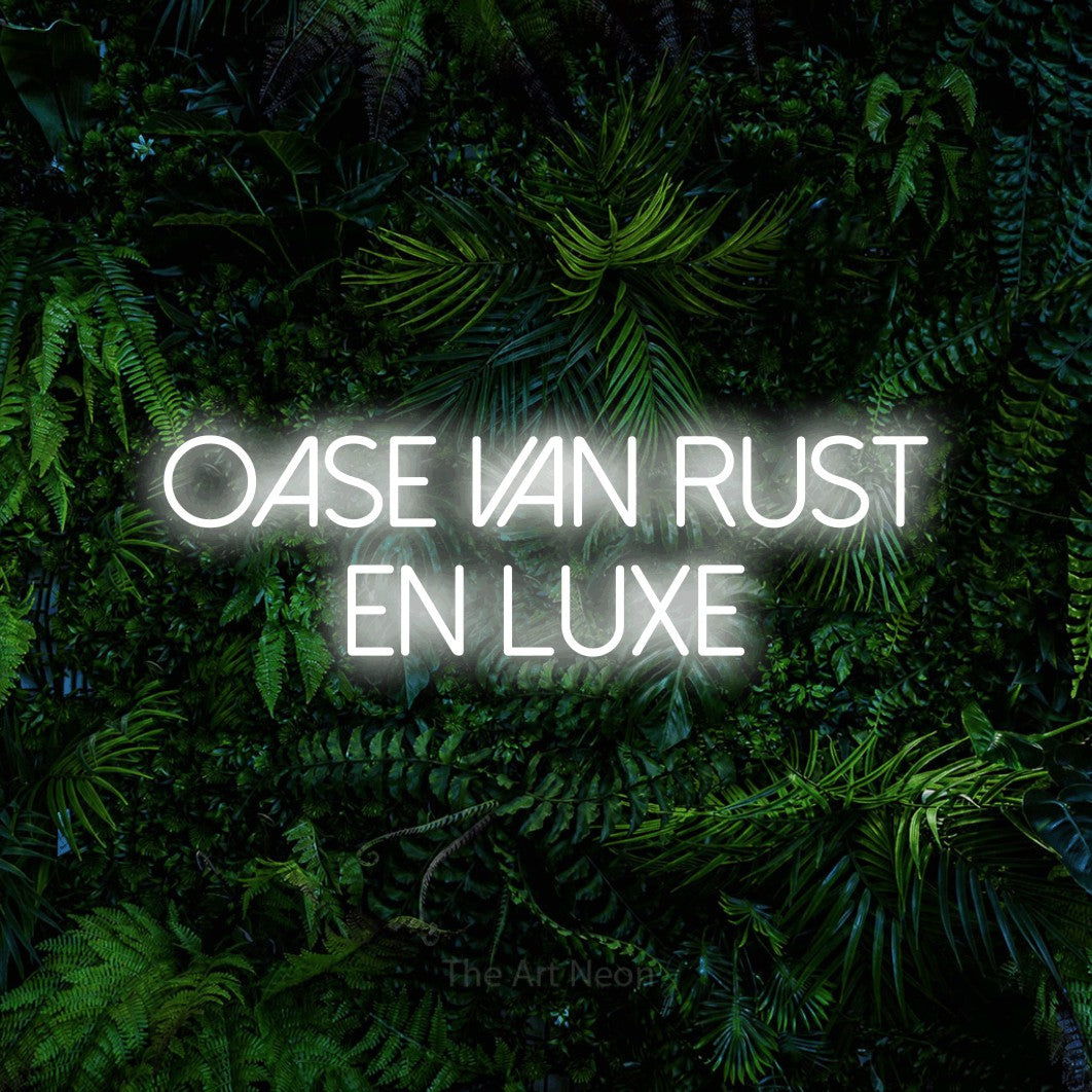LED neon sign reading “OASE van rust en luxe”, arranged in 2 lines.