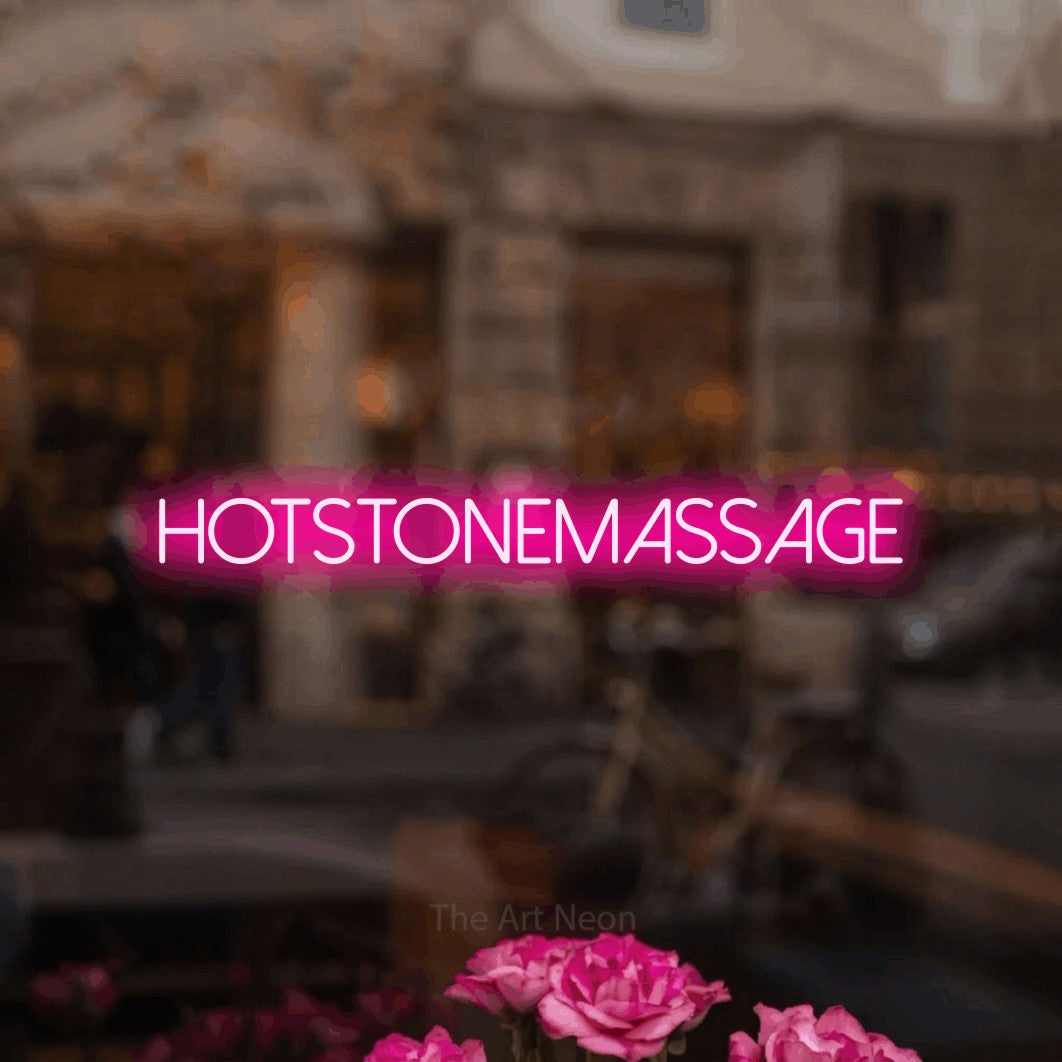 LED neon sign reading “hotstonemassage”, arranged in a single line.