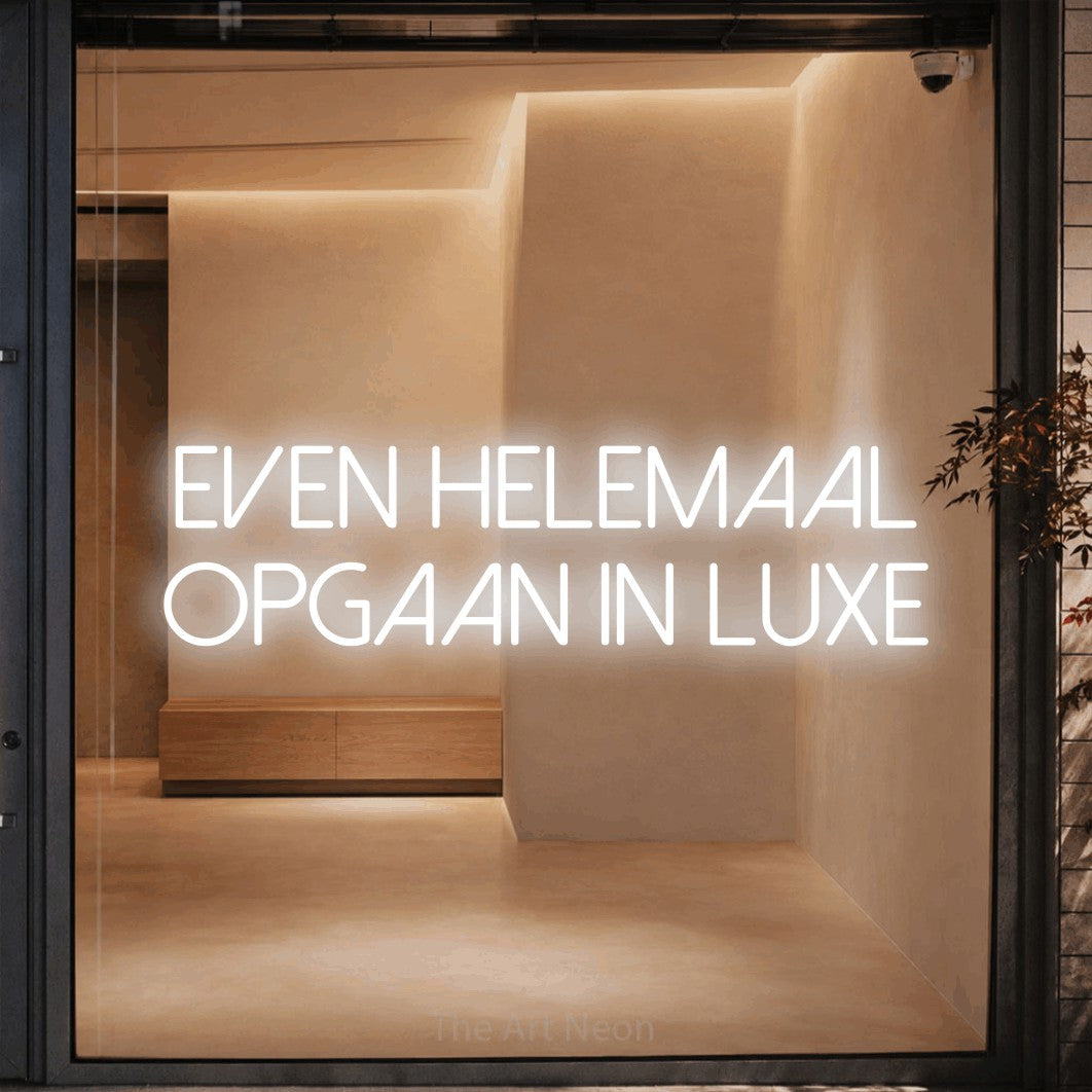LED neon sign reading “EVEN HELEMAAL OPGAAN IN LUXE”, arranged in 2 lines.