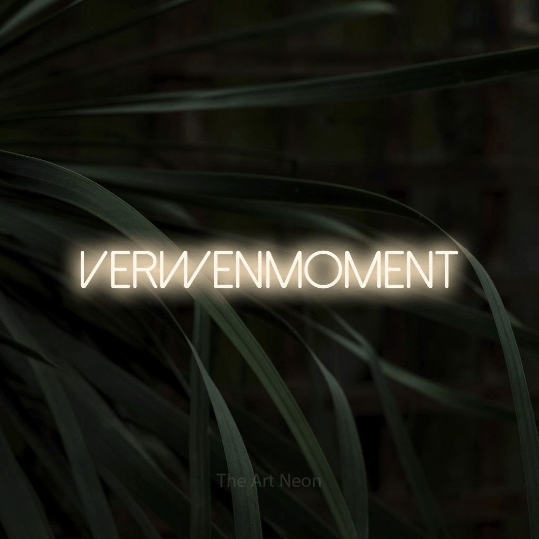 LED neon sign reading “verwenmoment”, arranged in a single line.