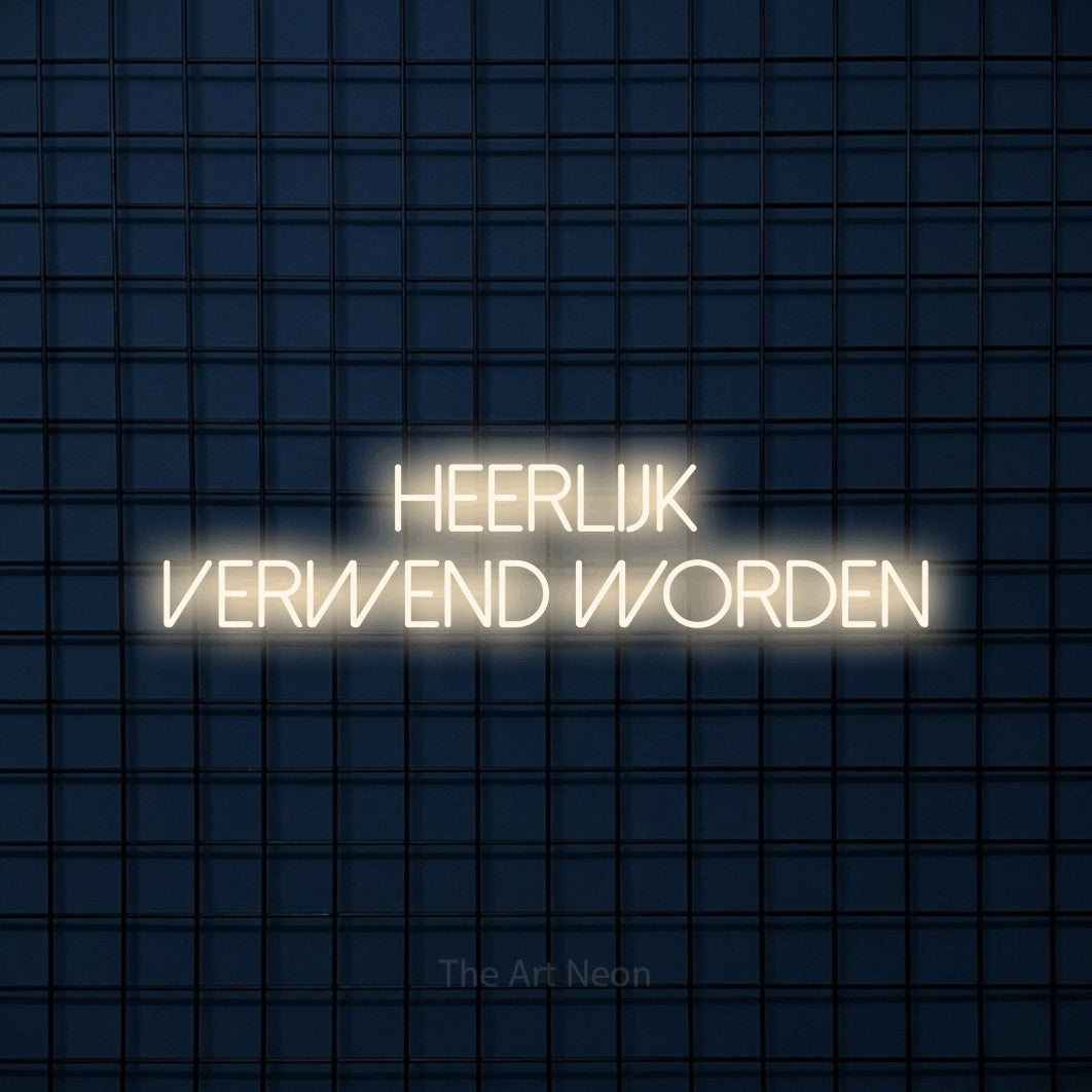 LED neon sign reading “heerlijk verwend worden”, arranged in 2 lines.