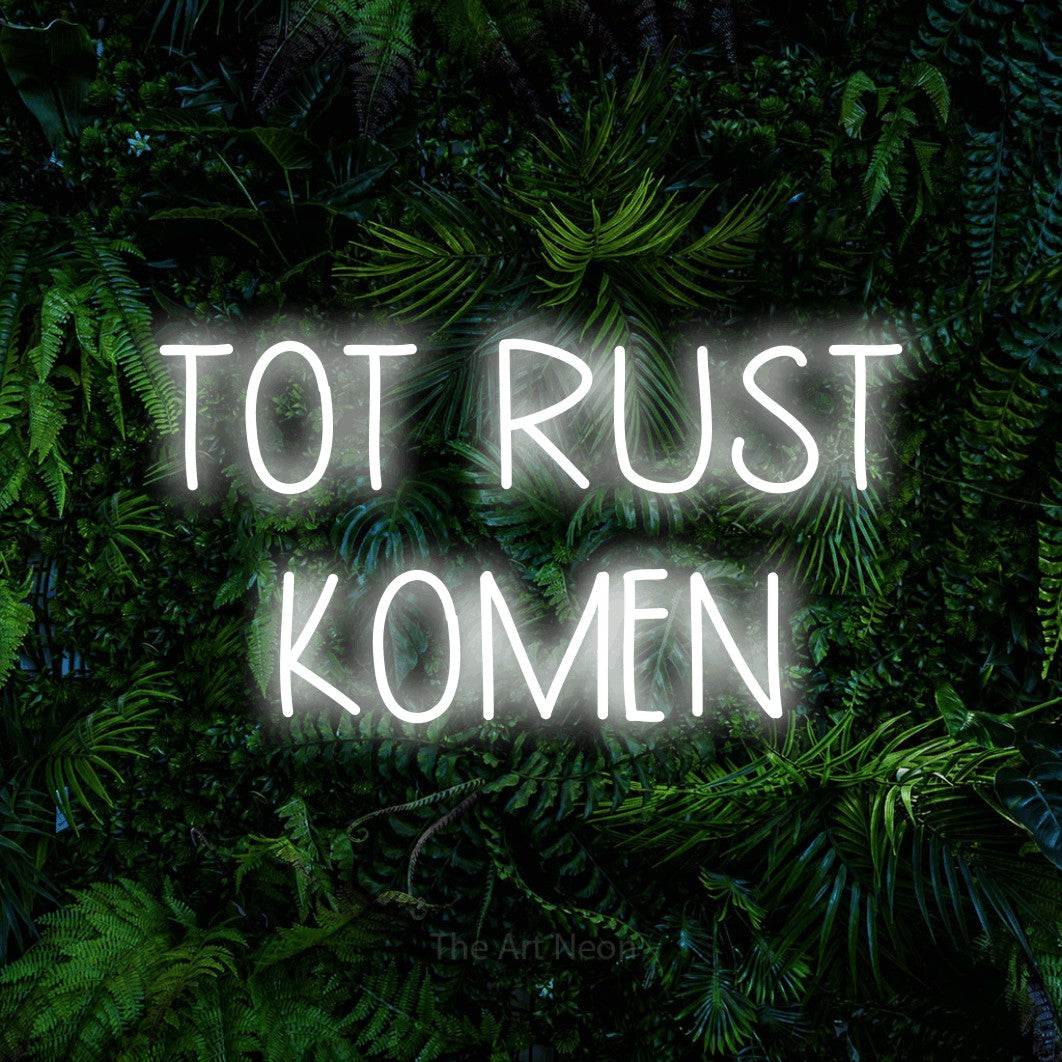 LED neon sign reading “TOT RUST KOMEN”, arranged in 2 lines.