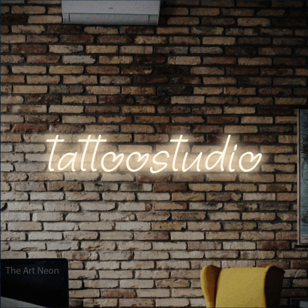 LED neon sign reading “tattoostudio”, arranged in a single line.