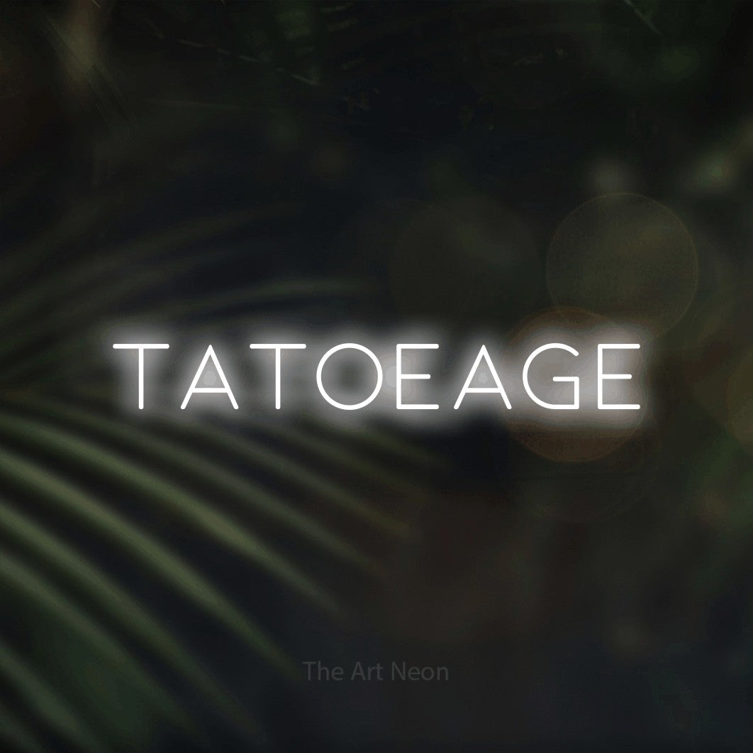 LED neon sign reading “tatoeage”, arranged in a single line.
