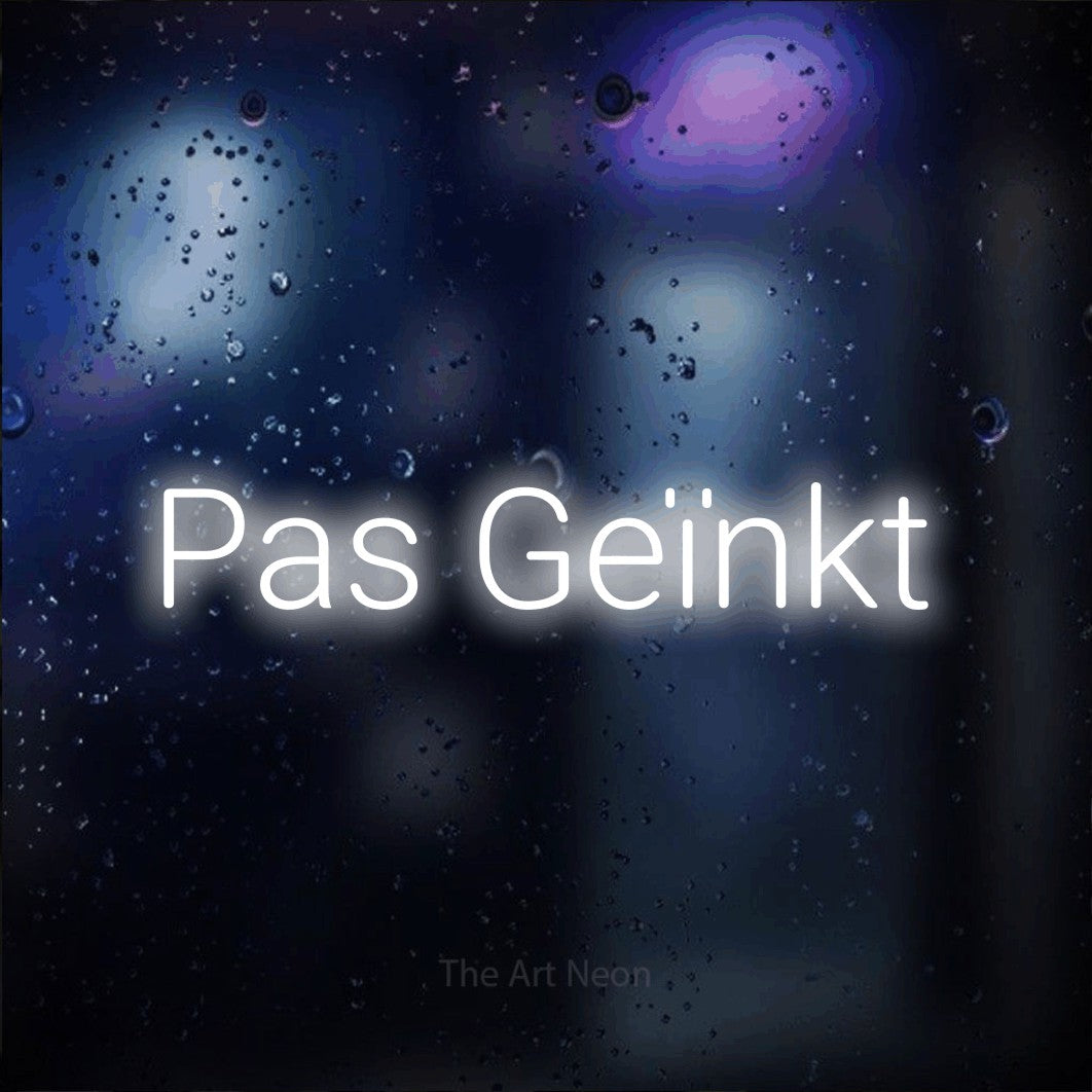 LED neon sign reading “Pas Geïnkt”, arranged in a single line.