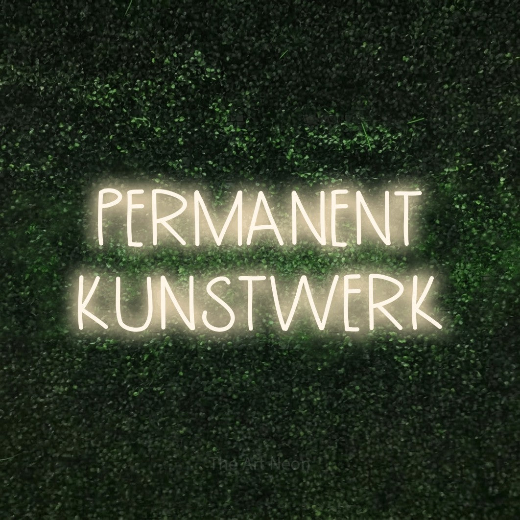 LED neon sign reading “PERMANENT KUNSTWERK”, arranged in 2 lines.