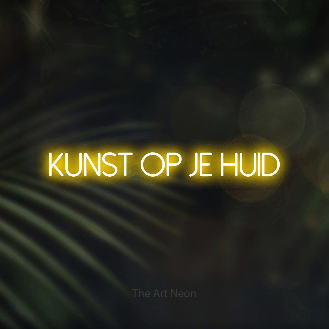 LED neon sign reading “kunst op je huid”, arranged in a single line.