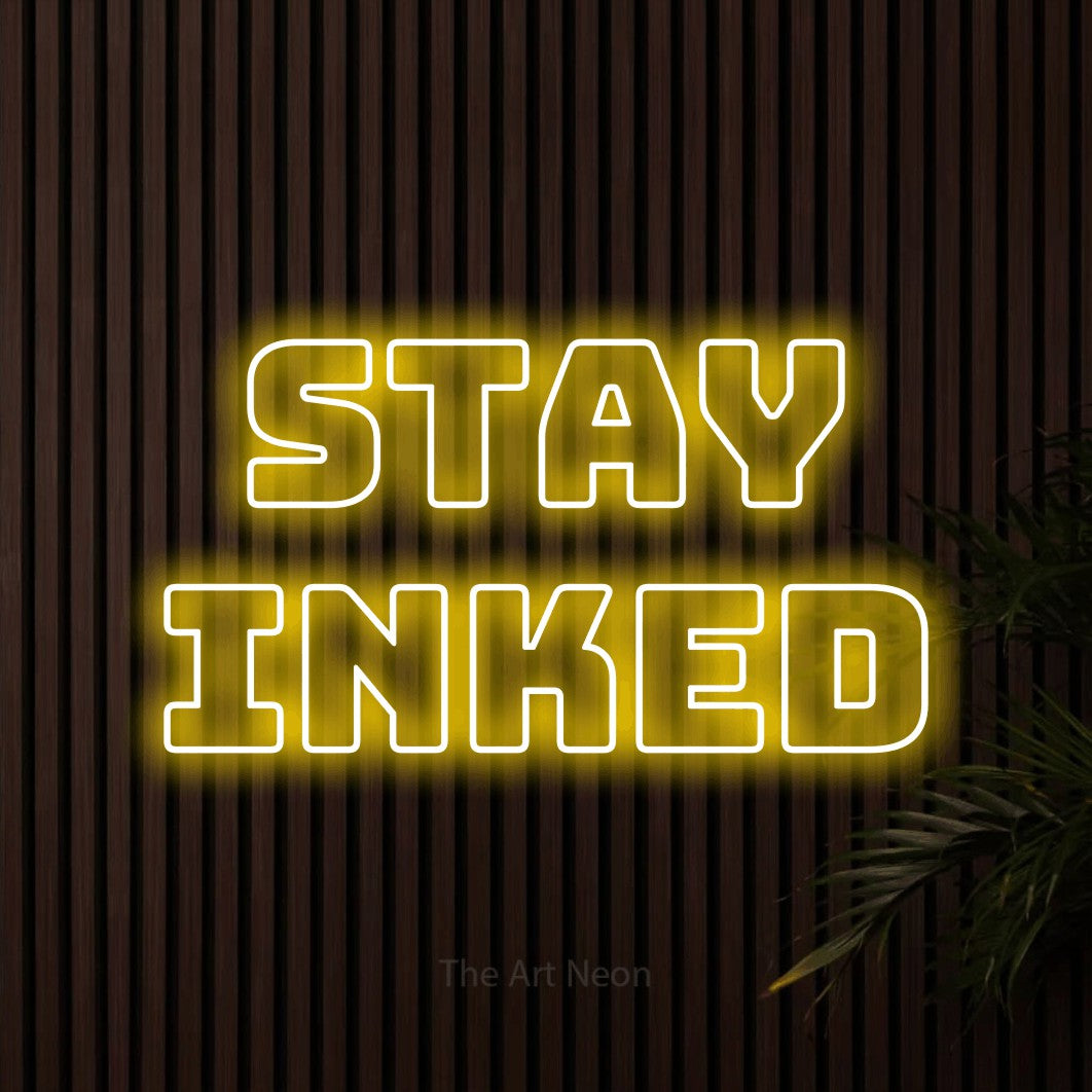 LED neon sign reading “stay inked”, arranged in 2 lines.