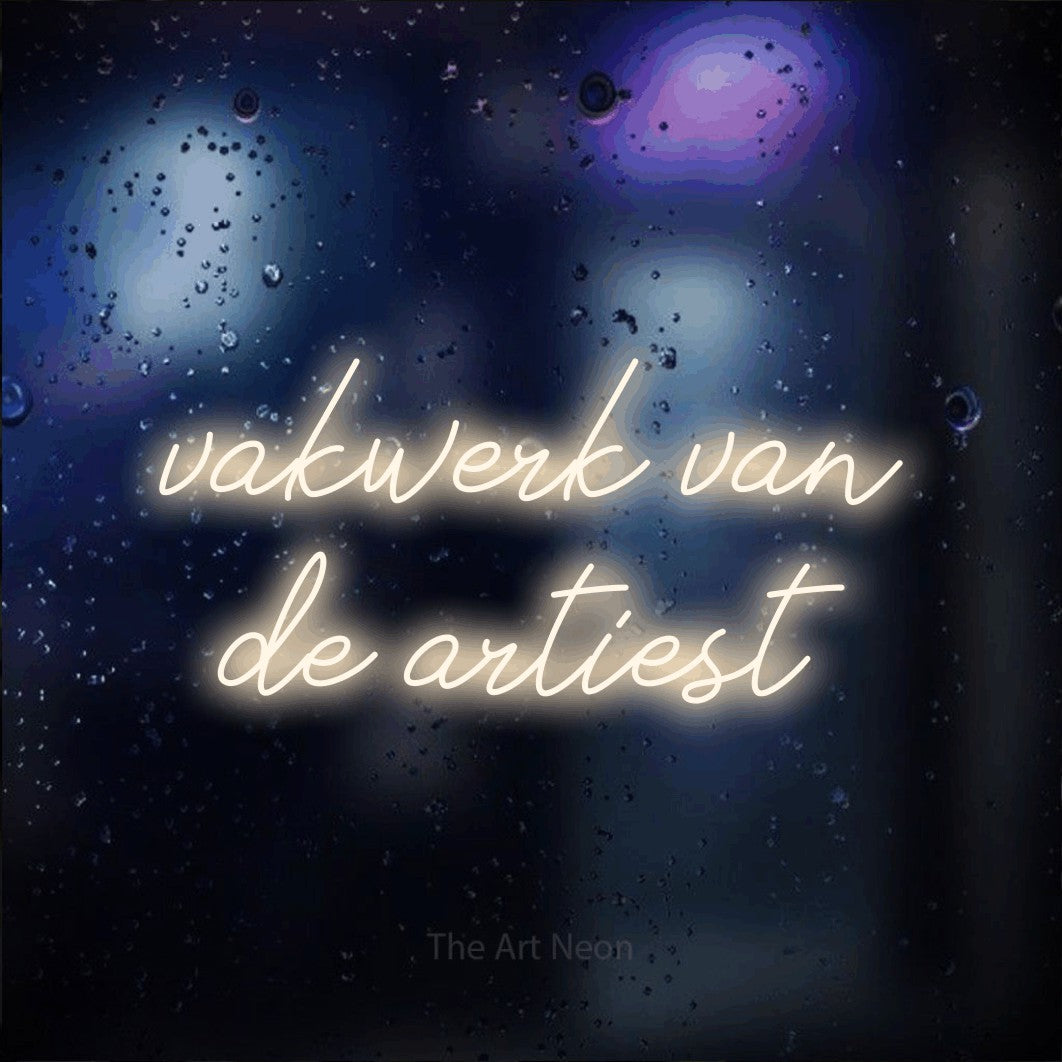 LED neon sign reading “vakwerk van de artiest”, arranged in 2 lines.