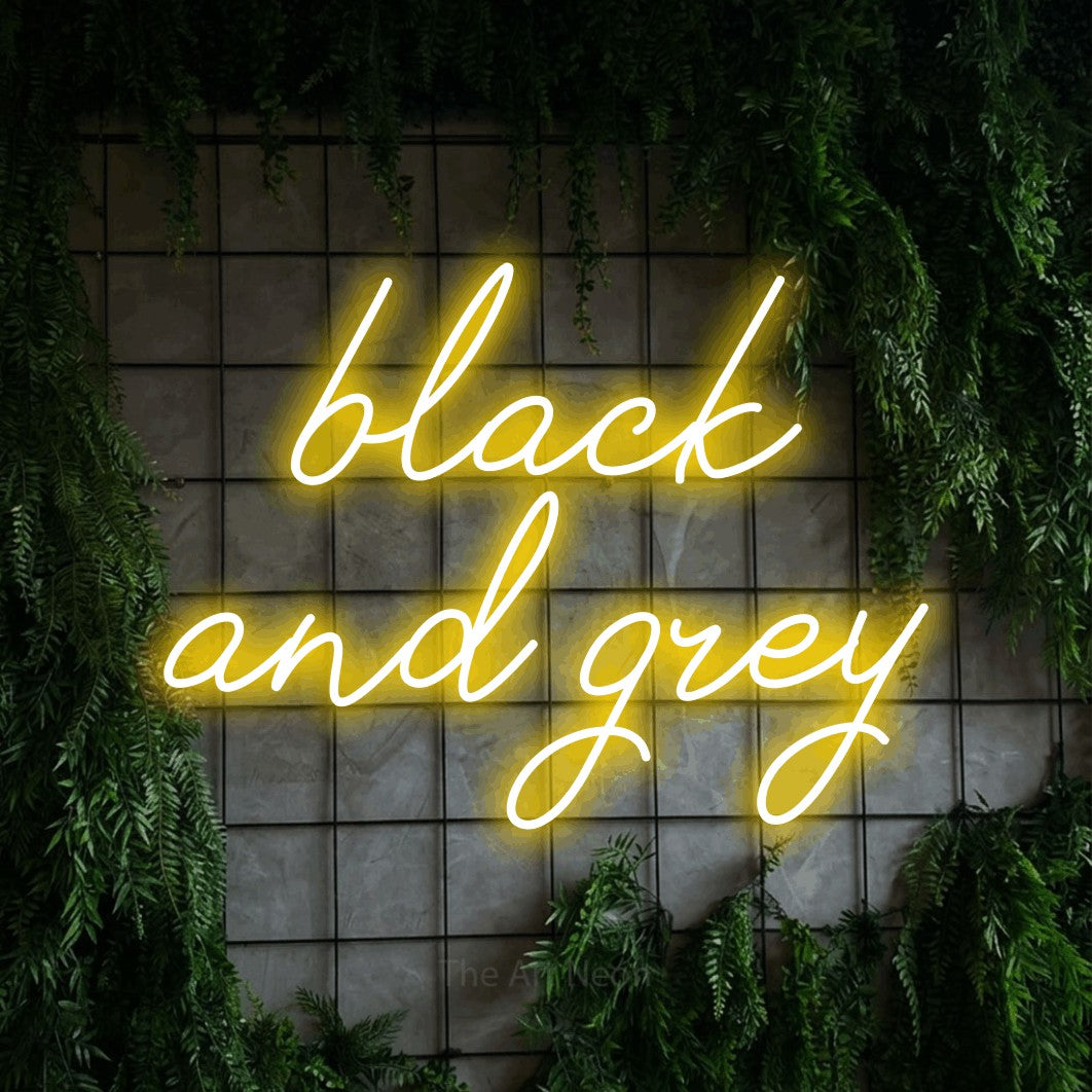 LED neon sign reading “black and grey”, arranged in 2 lines.