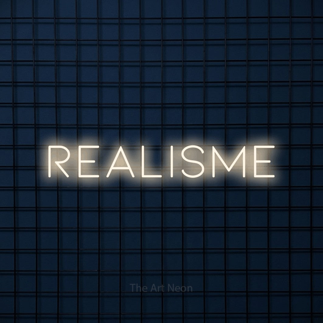 LED neon sign reading “REALISME”, arranged in a single line.