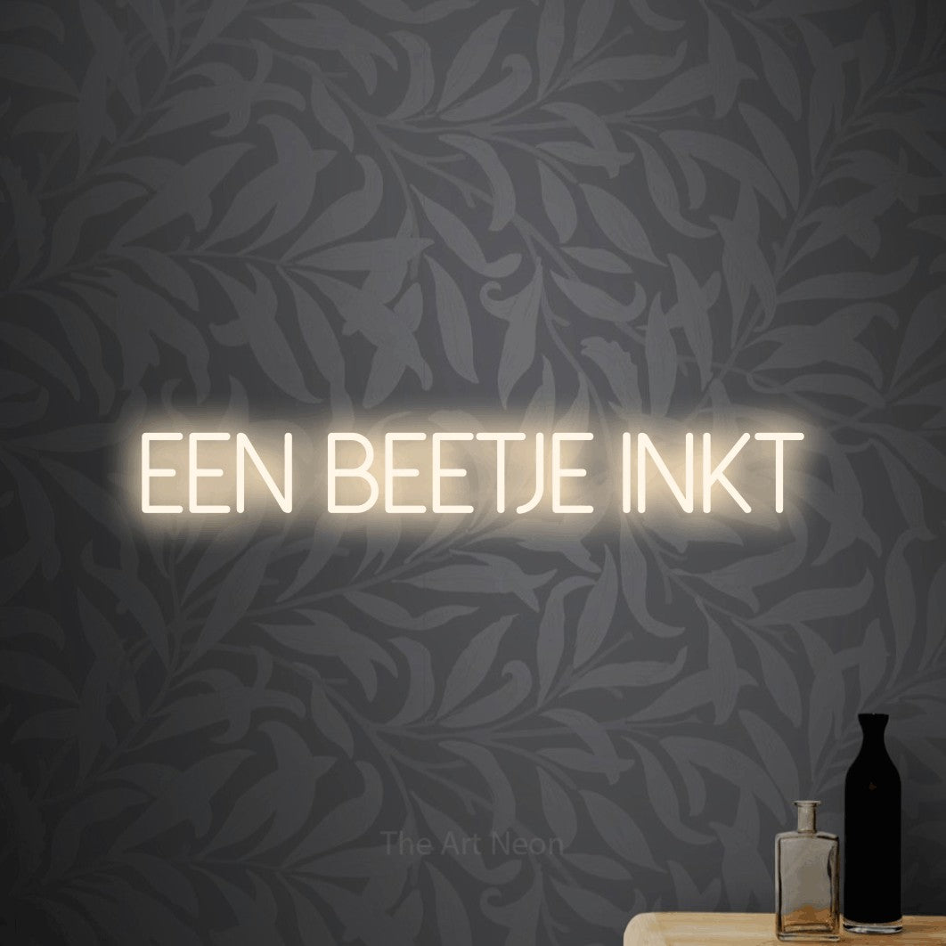 LED neon sign reading “Een Beetje Inkt”, arranged in a single line.