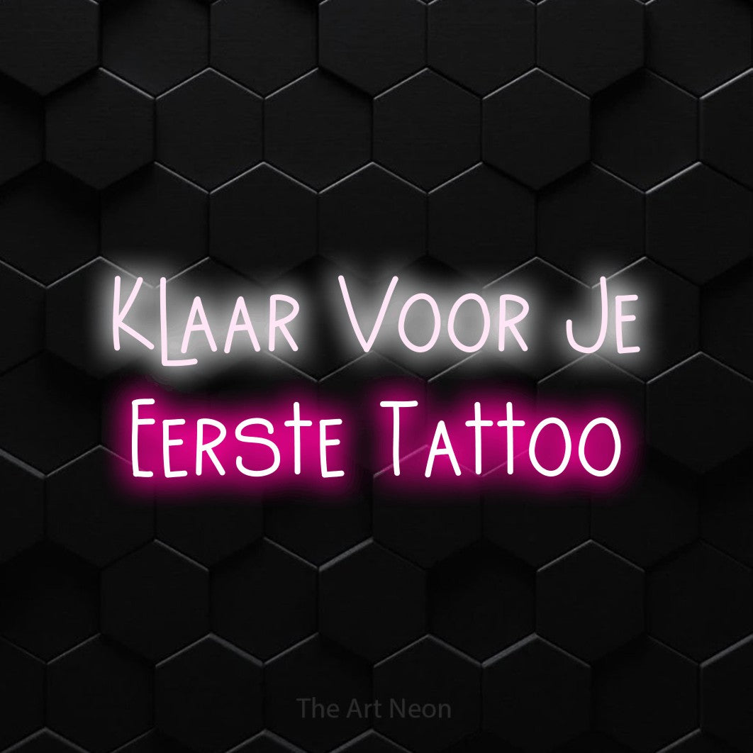 LED neon sign reading “Klaar Voor Je Eerste Tattoo”, arranged in 2 lines.