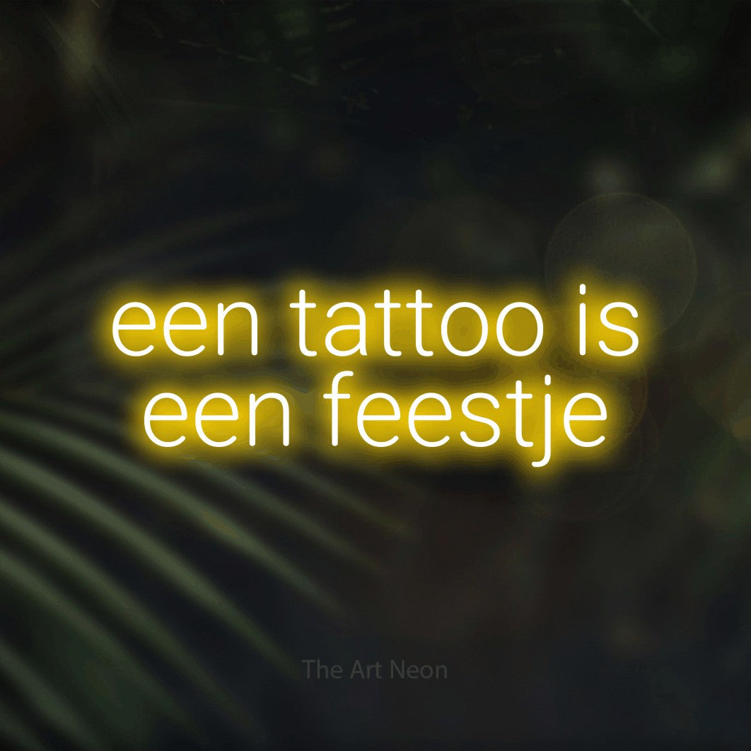 LED neon sign reading “een tattoo is een feestje”, arranged in 2 lines.