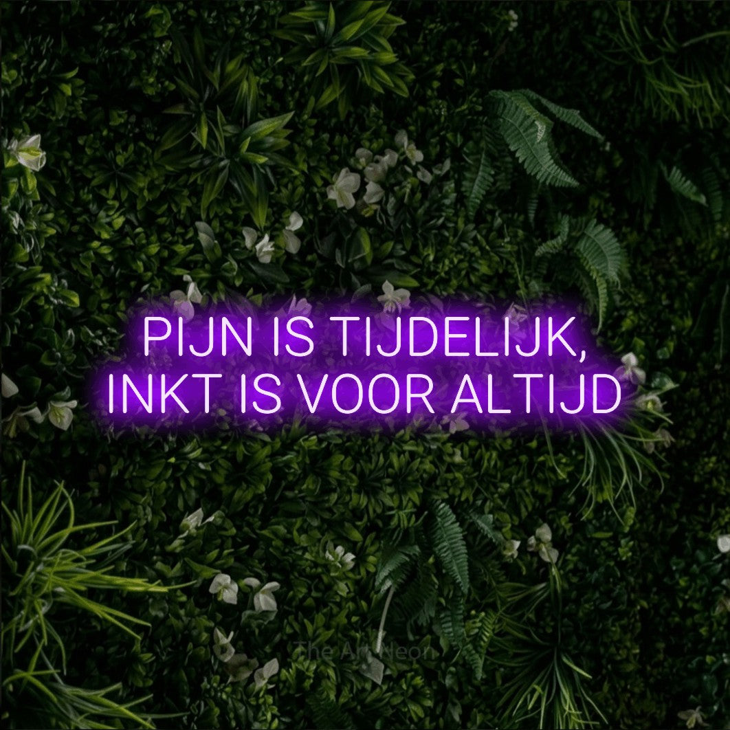 LED neon sign reading “PIJN IS TIJDELIJK, INKT IS VOOR ALTIJD”, arranged in 2 lines.