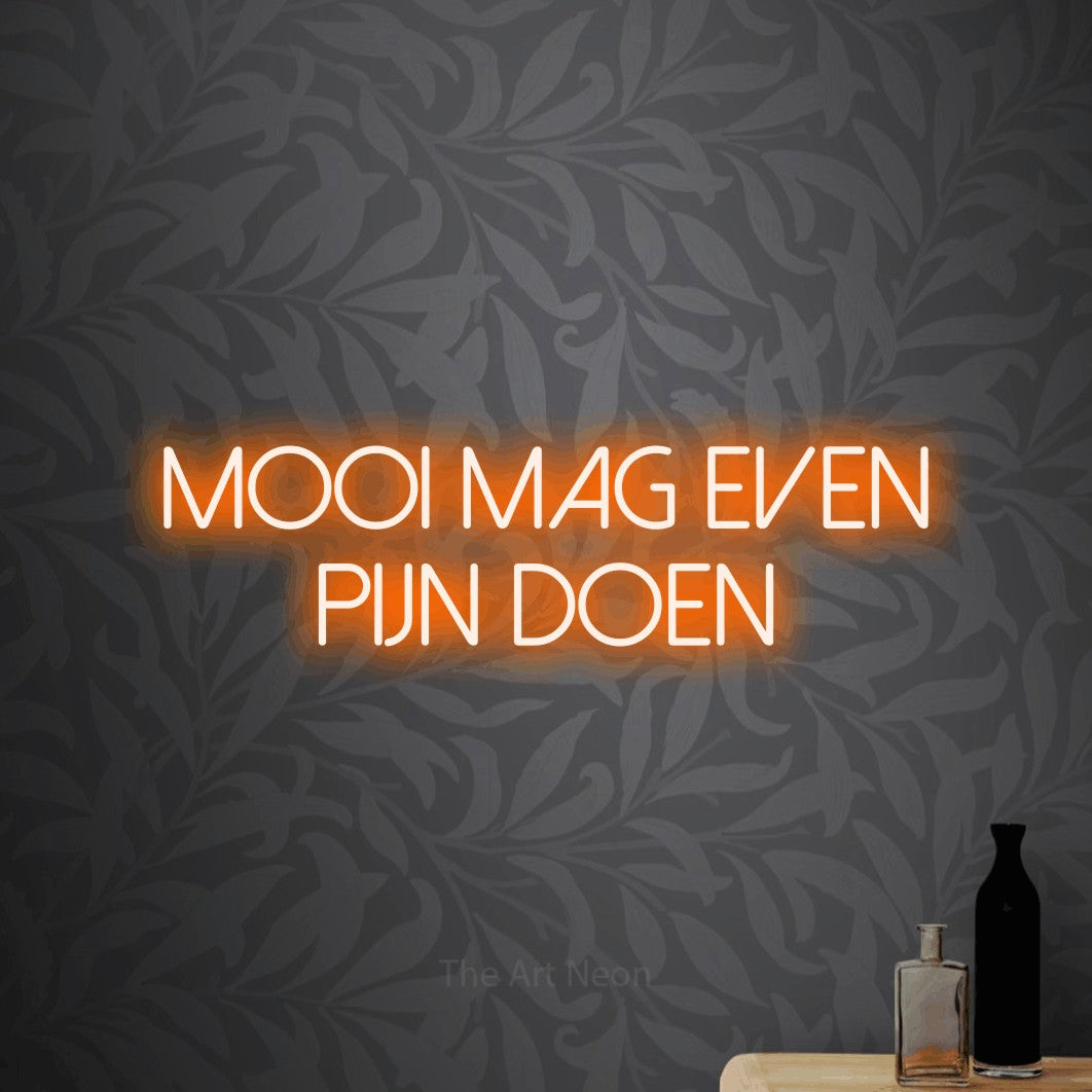 LED neon sign reading “Mooi Mag Even Pijn Doen”, arranged in 2 lines.