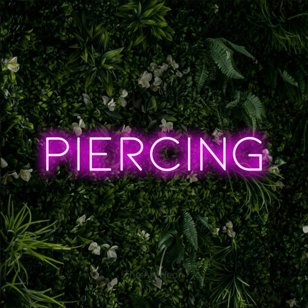 LED neon sign reading “piercing”, arranged in a single line.