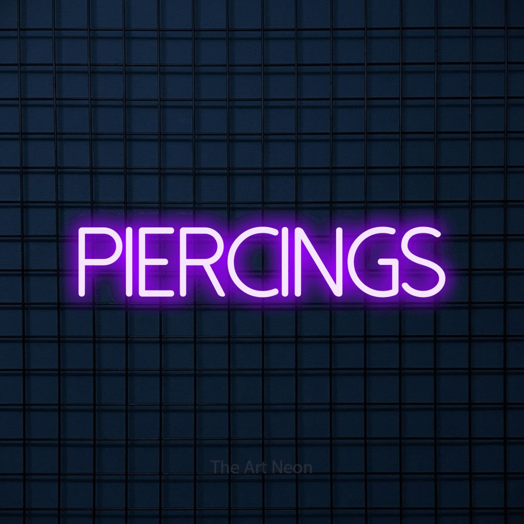 LED neon sign reading “Piercings”, arranged in a single line.