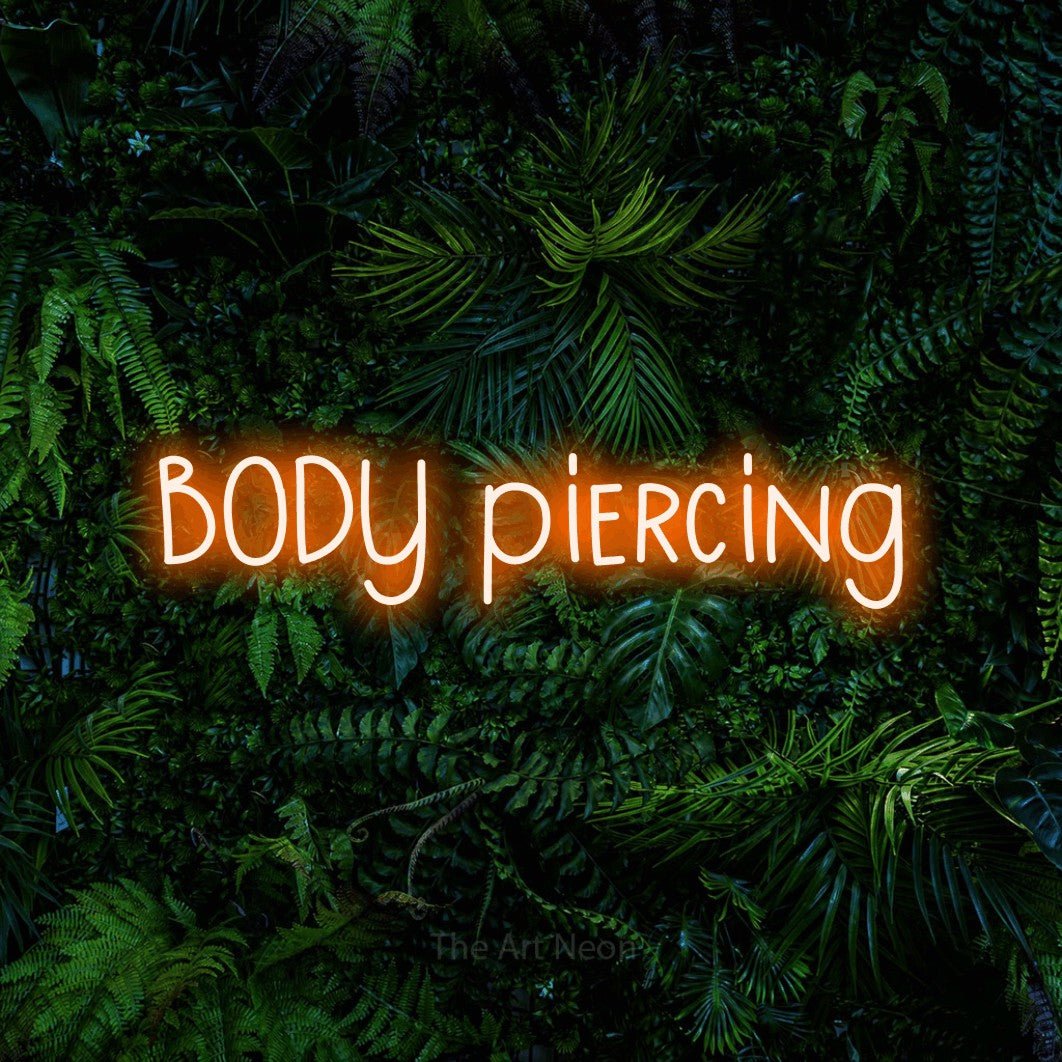 LED neon sign reading “BODY piercing”, arranged in a single line.