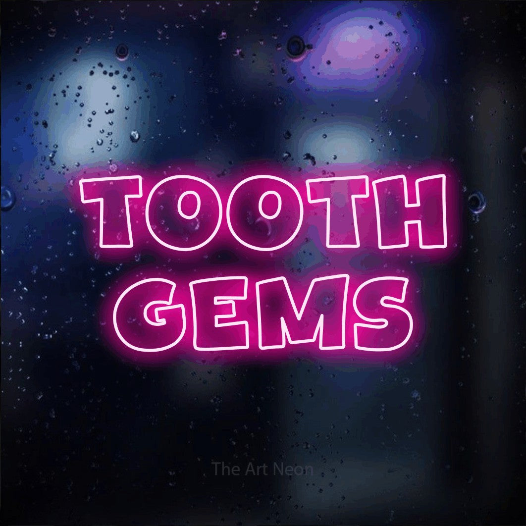LED neon sign reading “Tooth Gems”, arranged in 2 lines.