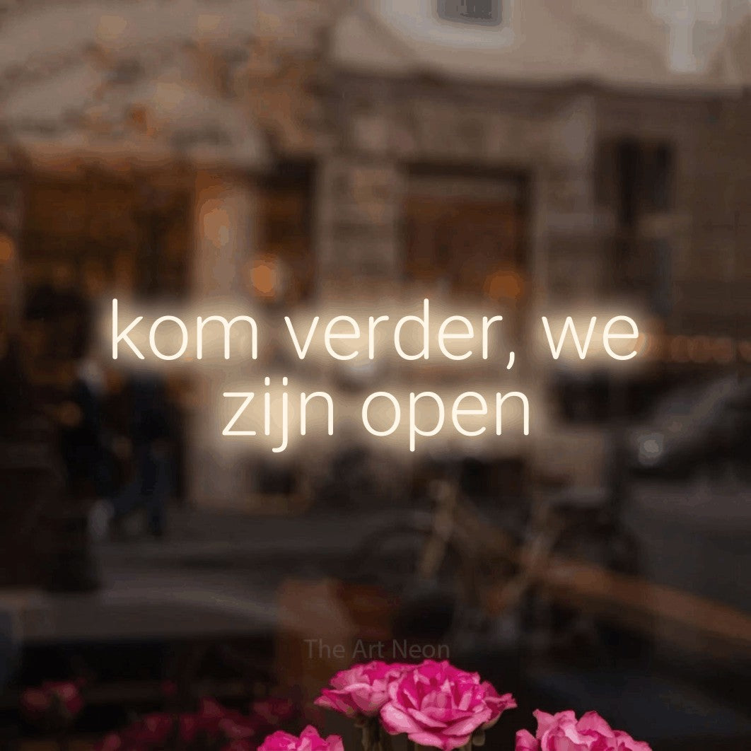 LED neon sign reading “kom verder, we zijn open”, arranged in 2 lines.