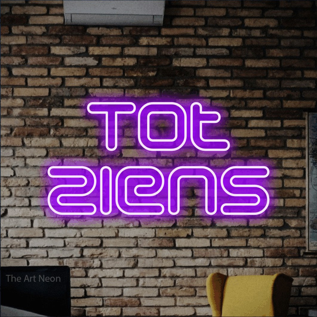 LED neon sign reading “Tot Ziens”, arranged in 2 lines.
