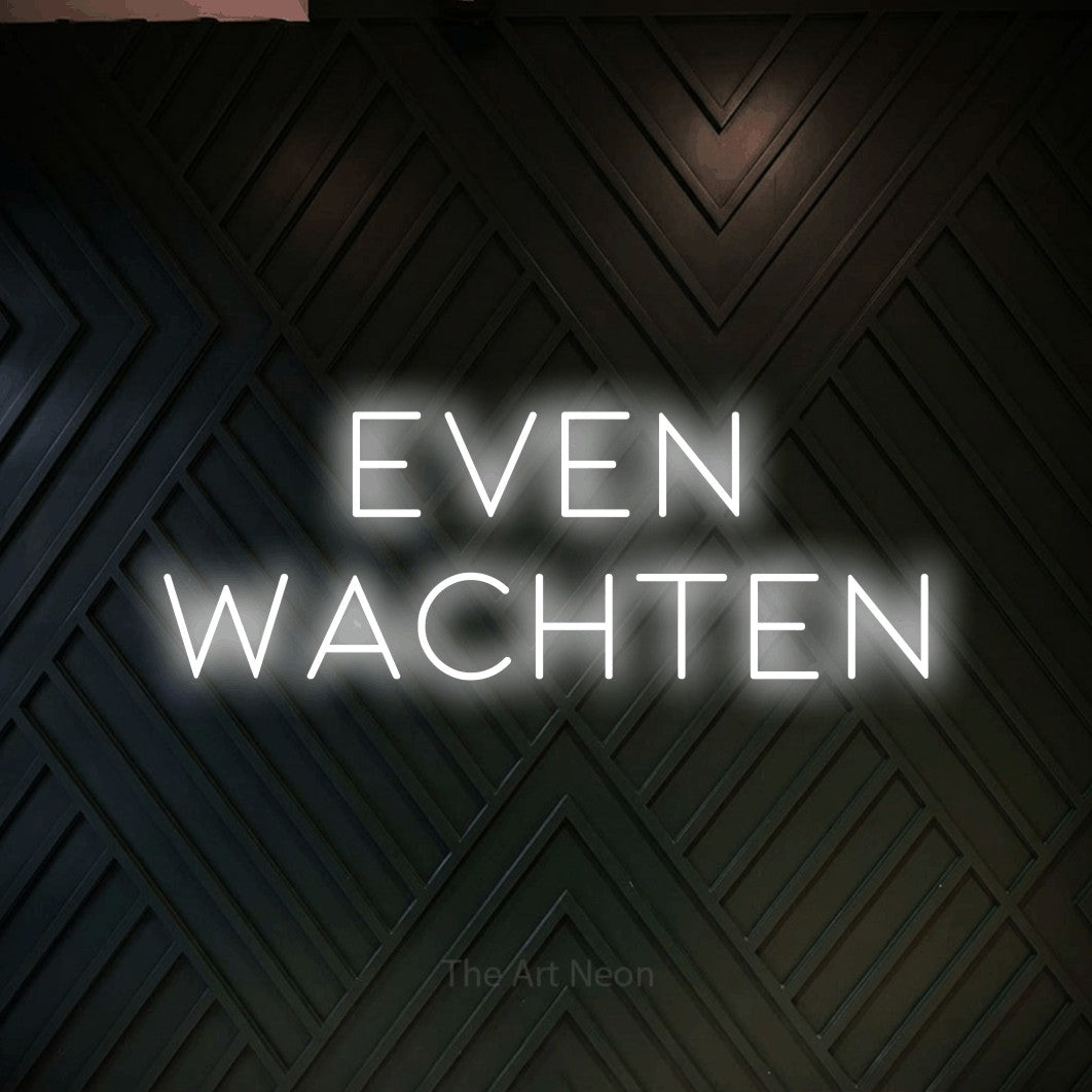 LED neon sign reading “Even wachten”, arranged in 2 lines.