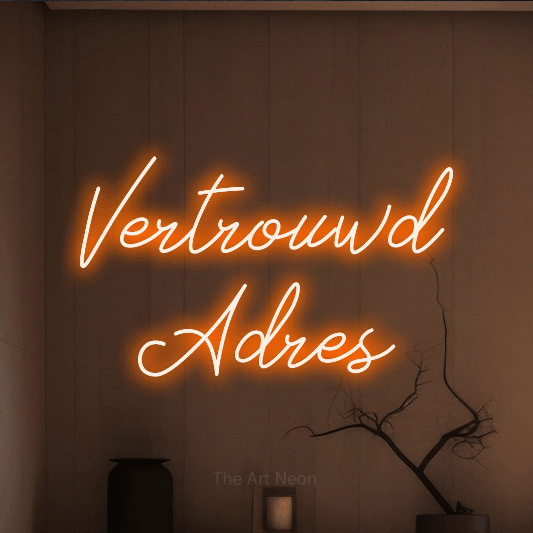 LED neon sign reading “Vertrouwd Adres”, arranged in 2 lines.