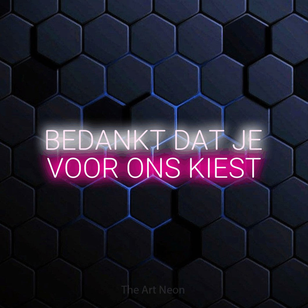 LED neon sign reading “BEDANKT DAT JE VOOR ONS KIEST”, arranged in 2 lines.