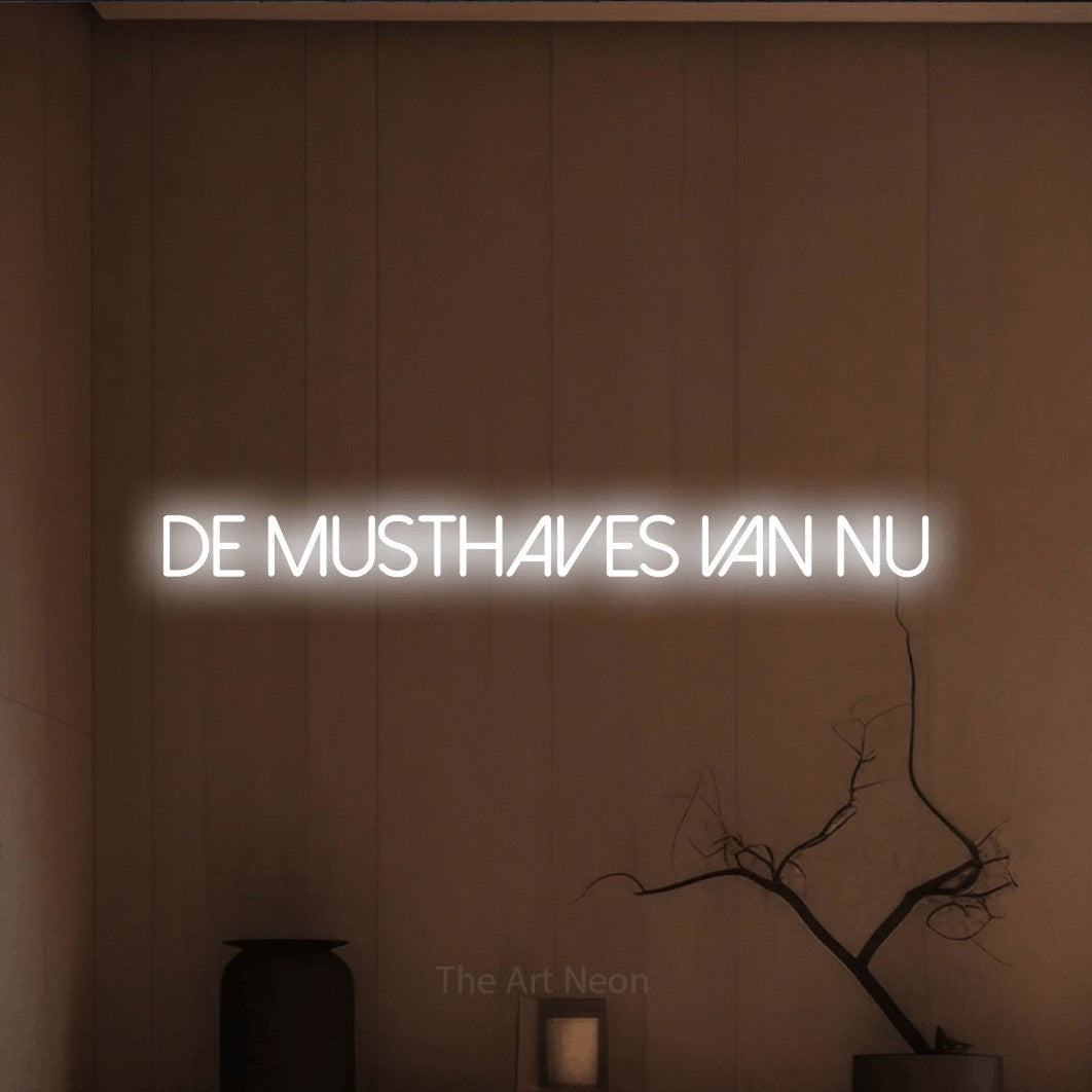 LED neon sign reading “DE MUSTHAVES VAN NU”, arranged in a single line.