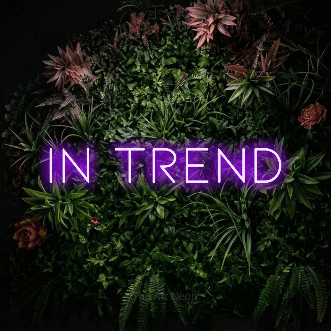 LED neon sign reading “In trend”, arranged in a single line.