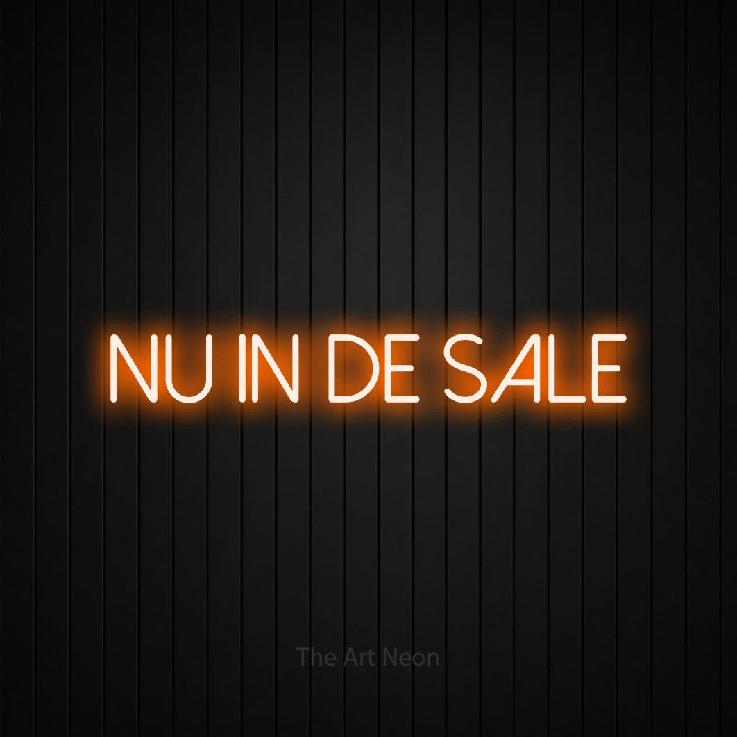 LED neon sign reading “Nu in de sale”, arranged in a single line.