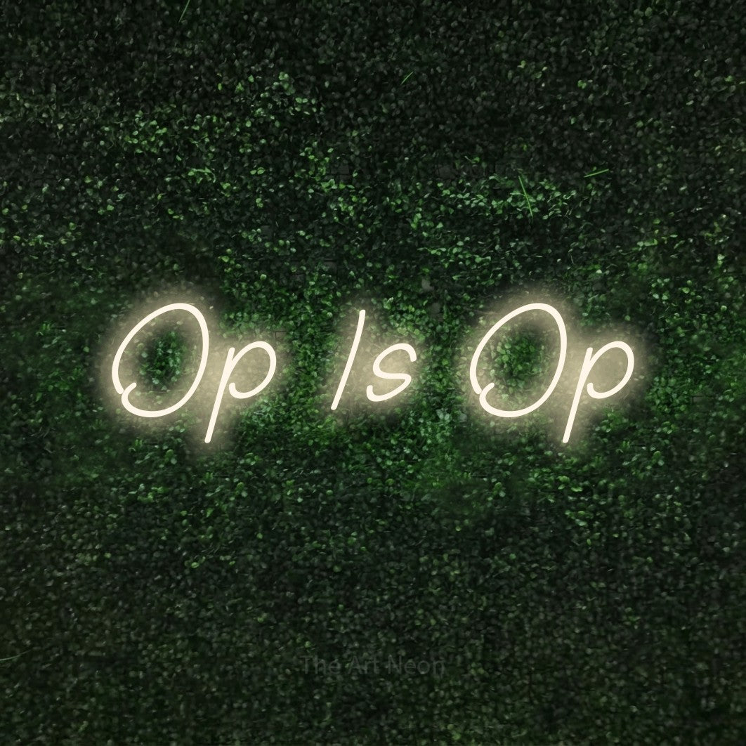 LED neon sign reading “Op Is Op”, arranged in a single line.