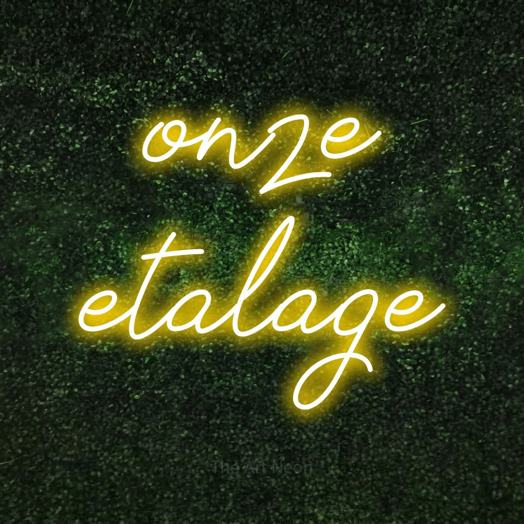 LED neon sign reading “onze etalage”, arranged in 2 lines.