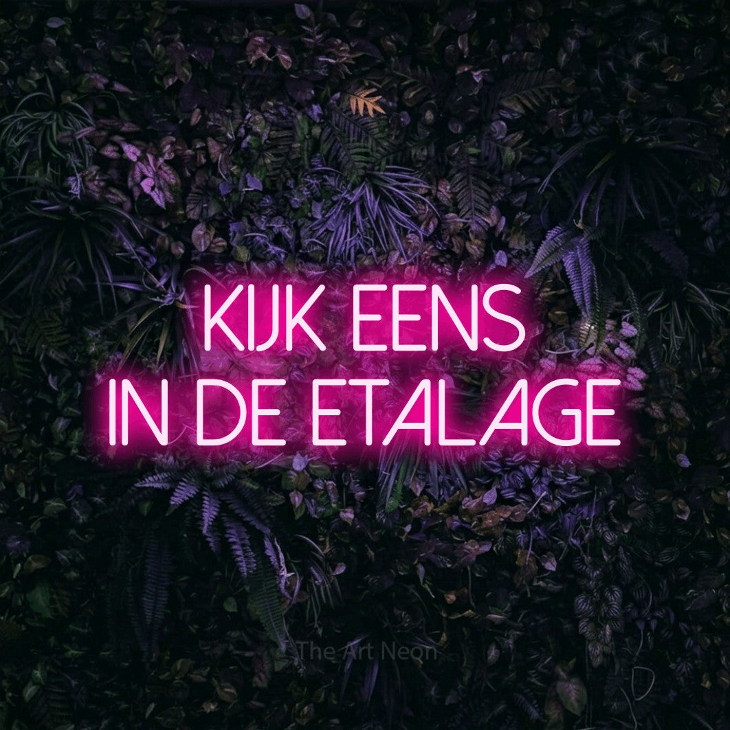 LED neon sign reading “KIJK eens in de etalage”, arranged in 2 lines.