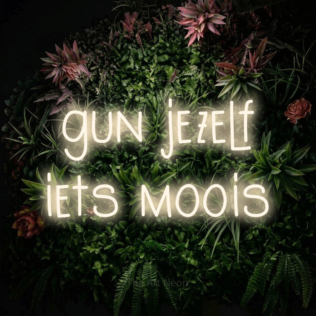 LED neon sign reading “gun jezelf iets moois”, arranged in 2 lines.