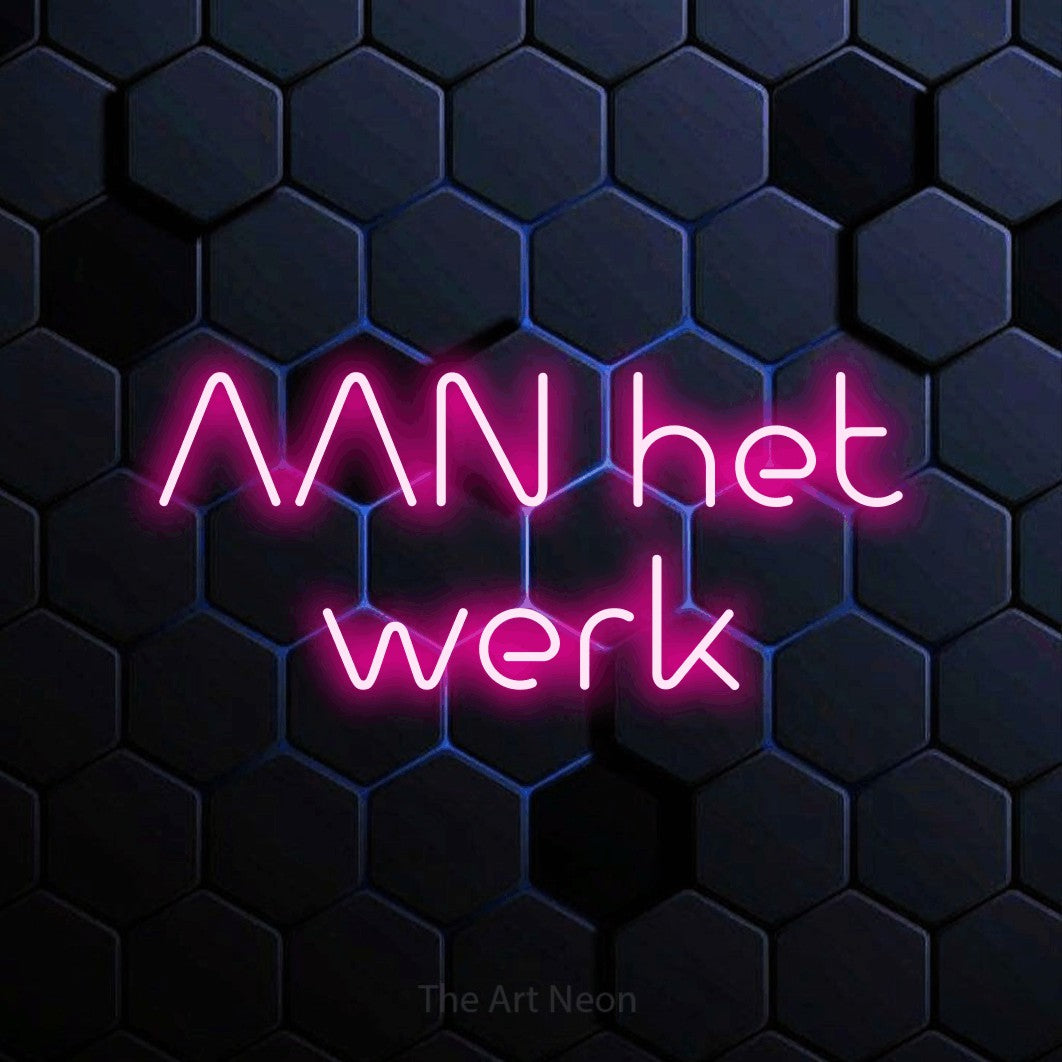 LED neon sign reading “AAN het werk”, arranged in 2 lines.