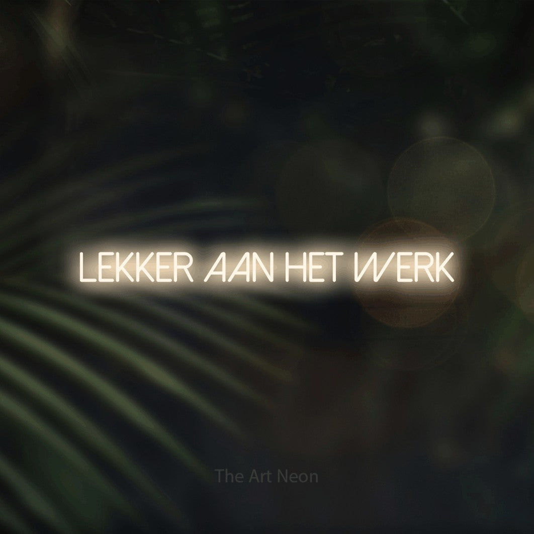 LED neon sign reading “Lekker Aan Het Werk”, arranged in a single line.