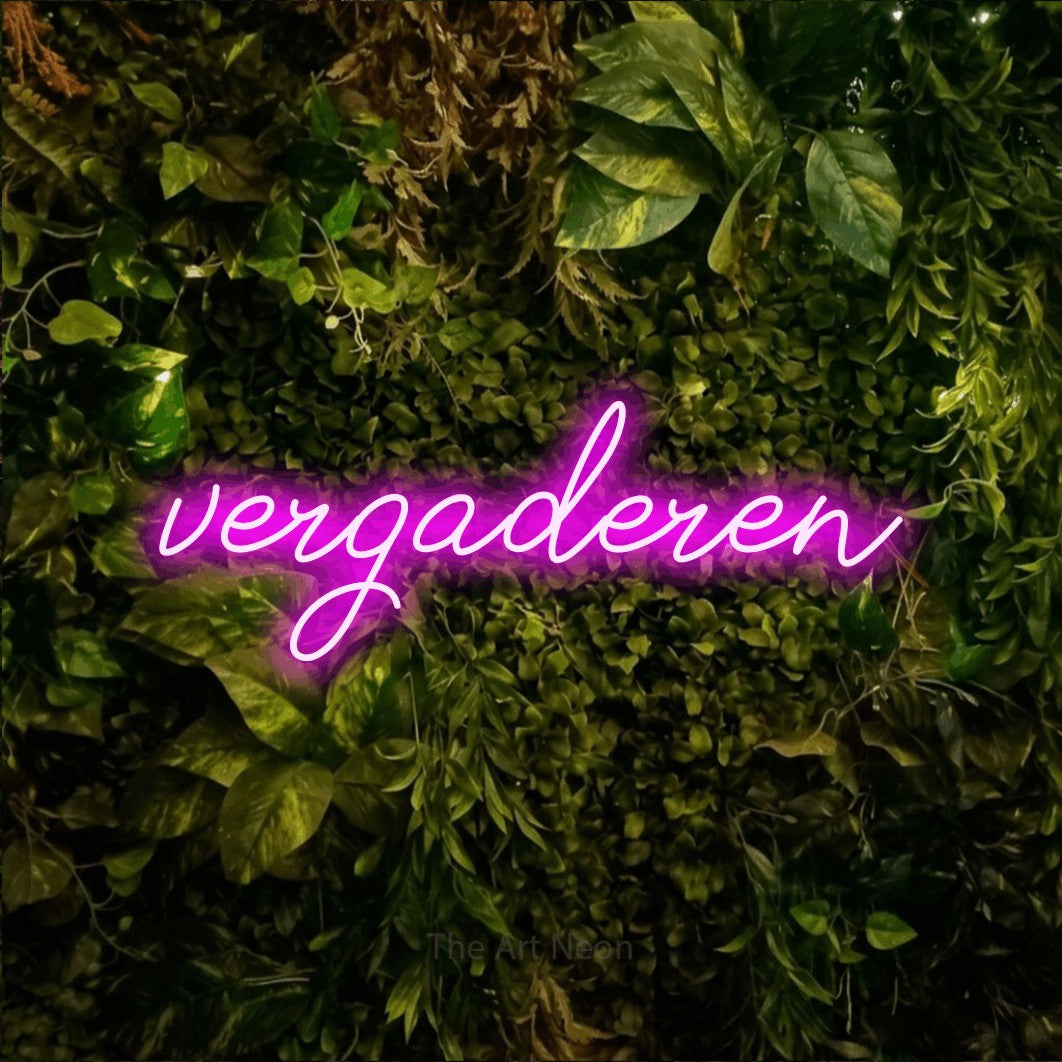 LED neon sign reading “vergaderen”, arranged in a single line.