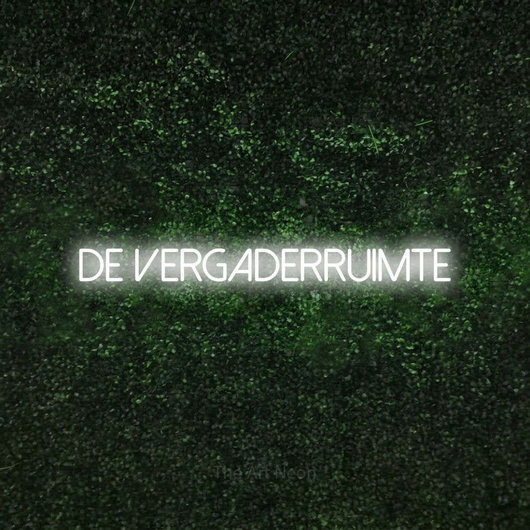 LED neon sign reading “de vergaderruimte”, arranged in a single line.