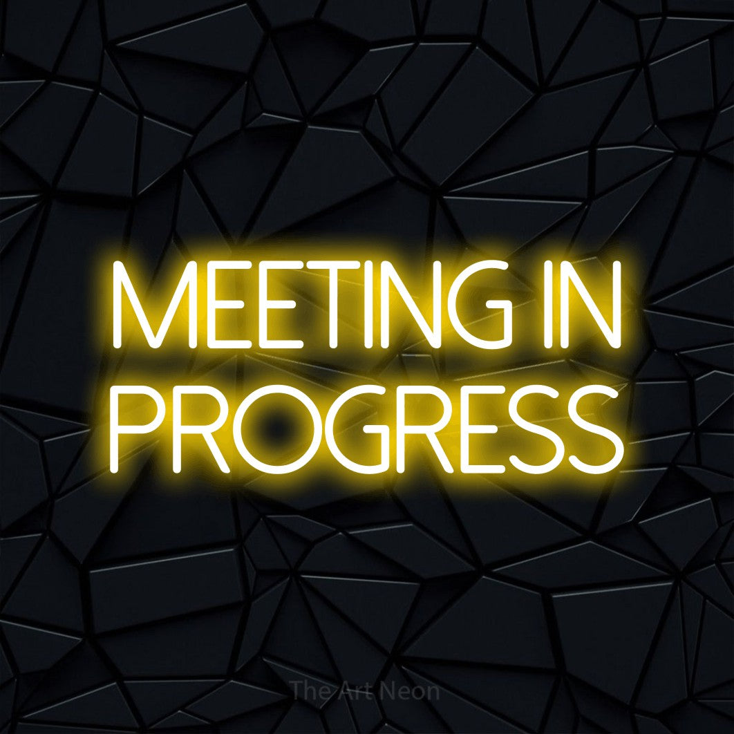 LED neon sign reading “MEETING in progress”, arranged in 2 lines.
