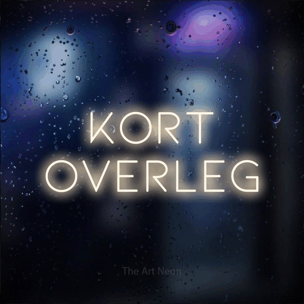 LED neon sign reading “KORT OVERLEG”, arranged in 2 lines.