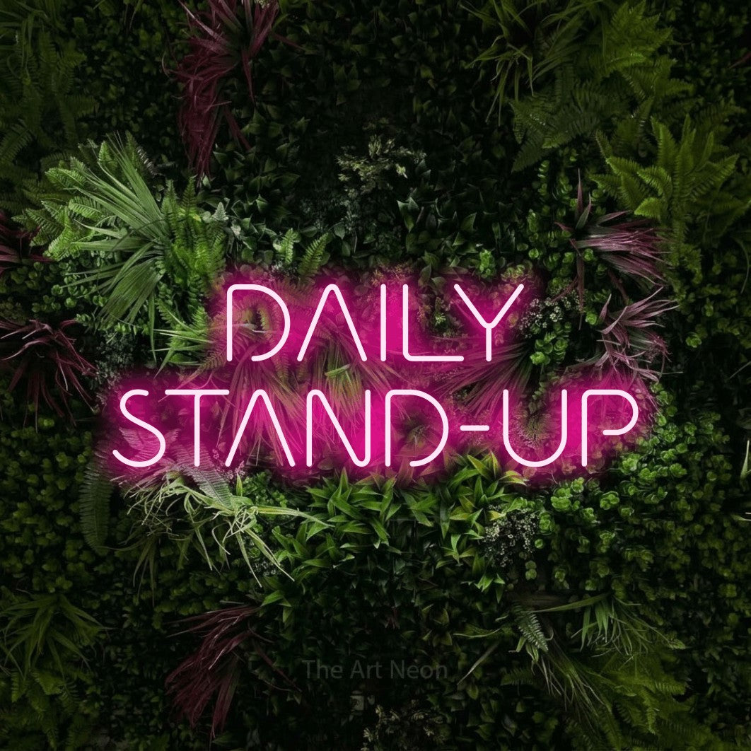 LED neon sign reading “DAILY STAND-UP”, arranged in 2 lines.